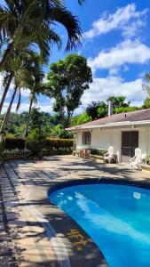 Bazén v ubytování Tropical Paradise Retirement Village Inc nebo v jeho okolí