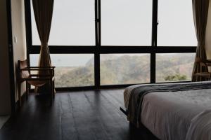 Voodi või voodid majutusasutuse DUNIA LOMBOK - Villas with Ocean View toas