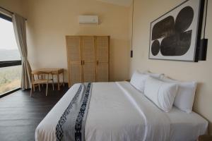 Voodi või voodid majutusasutuse DUNIA LOMBOK - Villas with Ocean View toas