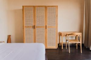 Voodi või voodid majutusasutuse DUNIA LOMBOK - Villas with Ocean View toas