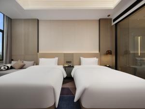 Postel nebo postele na pokoji v ubytování Crowne Plaza Dujiangyan by IHG