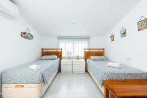 Posteľ alebo postele v izbe v ubytovaní Bungalow Sunrise Europa + 10 fotografií