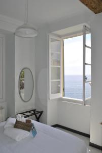 Кровать или кровати в номере Al Piccolo Scoglio - Room & Breakfast