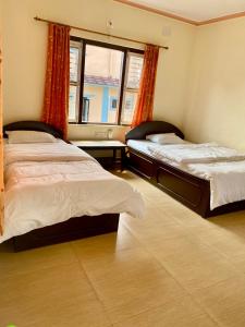 Cama o camas de una habitación en Hotel K2 Pokhara