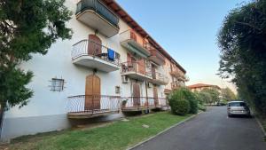 a building with balconies on the side of it at Il Girasole in Peschiera del Garda