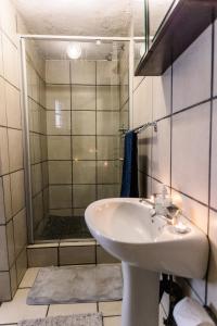 a bathroom with a sink and a shower at Stamvrug 9 B in Nelspruit