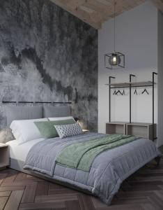 1 dormitorio con 1 cama con pared negra y gris en Alpenstyle Resort Fieberbrunn by AlpenTravel en Fieberbrunn