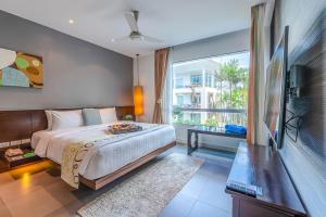 Postel nebo postele na pokoji v ubytování Paradox Resort Phuket