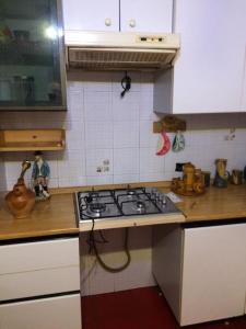 a kitchen with a stove and a counter top at Monolocale Palombara Sabina in Cretone