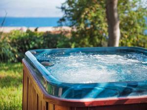 a bird sitting on top of a hot tub at Cluxury-Torre dei Saraceni BOUTIQUE APT BY THE SEA Beach, Pool,Private Jacuzzi, Parking in Cervo