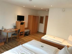 Postel nebo postele na pokoji v ubytování Flair Hotel Grüner Baum