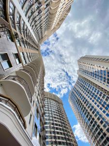 two tall buildings looking up at the sky at Sunday Rooms in Odesa