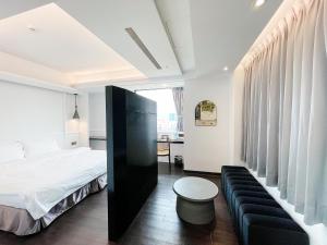 Postel nebo postele na pokoji v ubytování 小隱居Hermit Dorm-聖雄商旅