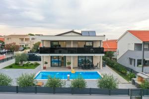an aerial view of a house with a swimming pool at Luxury Villa Marko in Vir