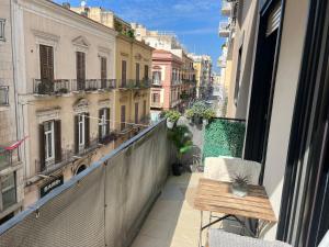 a balcony with a bench and a view of a city at Futura Exclusive Suite 4 in Bari