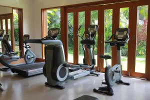 a gym with cardio machines in front of windows at WERT in Phuket Town