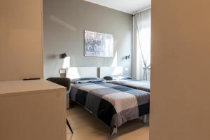 En eller flere senger på et rom på Arò Design Suite