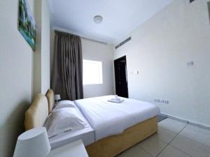 Abu Hail Star Residence - Home Stay客房内的一张或多张床位