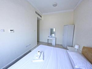 Abu Hail Star Residence - Home Stay客房内的一张或多张床位