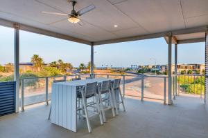a large balcony with a table and chairs on it at 120 Madaffari Drive in Exmouth