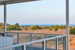a view of the desert from the balcony of a house at 120 Madaffari Drive in Exmouth