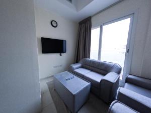 Abu Hail Star Residence - Home Stay客房内的一张或多张床位