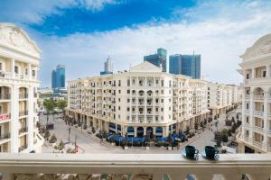 a view of a city street with tall buildings at Boulevard 181 in Tashkent