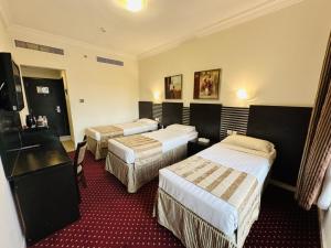 Postel nebo postele na pokoji v ubytování Miaad Al Majd Hotel