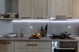 a kitchen counter with a tray of food on it at Apricot and Sea Luxury Villas in Mikri Vigla