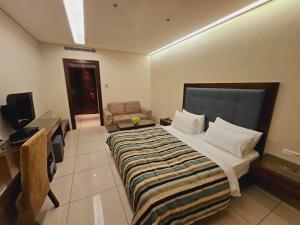 Sjónvarps- og/eða afþreyingartæki á Verdun Suites Hotel