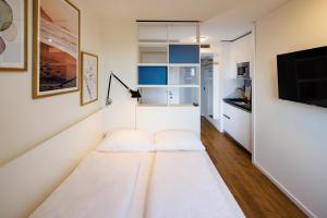 Ein Bett oder Betten in einem Zimmer der Unterkunft smartments Wien Heiligenstadt