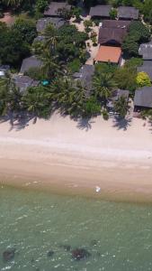 an aerial view of a beach with houses and the water at Bangpo Village Tiny Country Beach House in Koh Samui 