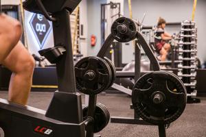 a group of people in a gym with weights at Tempus Te Premium Duo Lofts Tartu - private cinema, gym and terrace in Tartu
