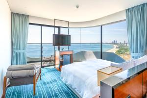 Ένα ή περισσότερα κρεβάτια σε δωμάτιο στο Hilton Garden Inn Da Nang