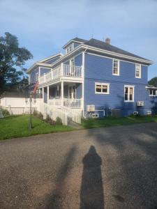 a shadow of a person standing in front of a house at The Home Place Inn in Kensington