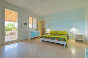 Кровать или кровати в номере Cava Li Santi Residence