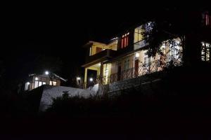 a building at night with lights on it at Oak valley retreat in Pelling