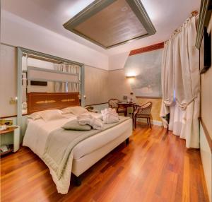 Giường trong phòng chung tại c-hotels Rubens