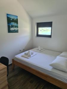 Postel nebo postele na pokoji v ubytování MONTEKARLO NA DRINI