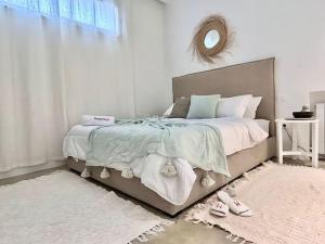 Llit o llits en una habitació de Baïa Appartment