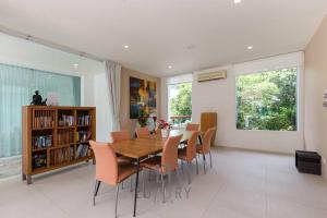 a dining room with a table and chairs at Unique Pool Villa with 5 Bedrooms and Sea View PM-C1 in Hua Hin