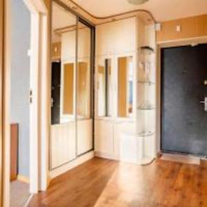 a large room with mirrors and a wooden floor at Apartment with a panoramic view of Podil near the metro in Kyiv