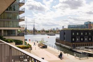 a view of a body of water with buildings at Convenient - ExCel London - O2- 3 Bedroom Apartment in London