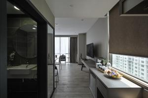 a large bathroom with a sink and a mirror at Asaya Damansara in Petaling Jaya