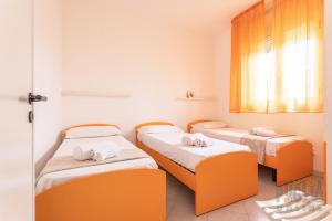 Säng eller sängar i ett rum på Villetta Tulipano a Torre Vado
