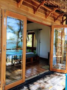 a room with sliding glass doors in a house at Resort Bai Xep Quy Nhon in Quy Nhon