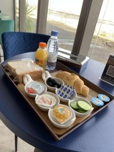 a tray with different types of food on a table at Golden Square in Khamis Mushayt