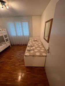 a room with a bed and a mirror in it at Centered Apartment with view in Altdorf