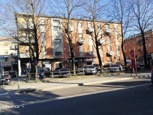 a city street with cars parked in front of buildings at B&B ARCOVEGGIO in Bologna