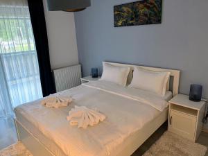 Postel nebo postele na pokoji v ubytování Tonka Apartment